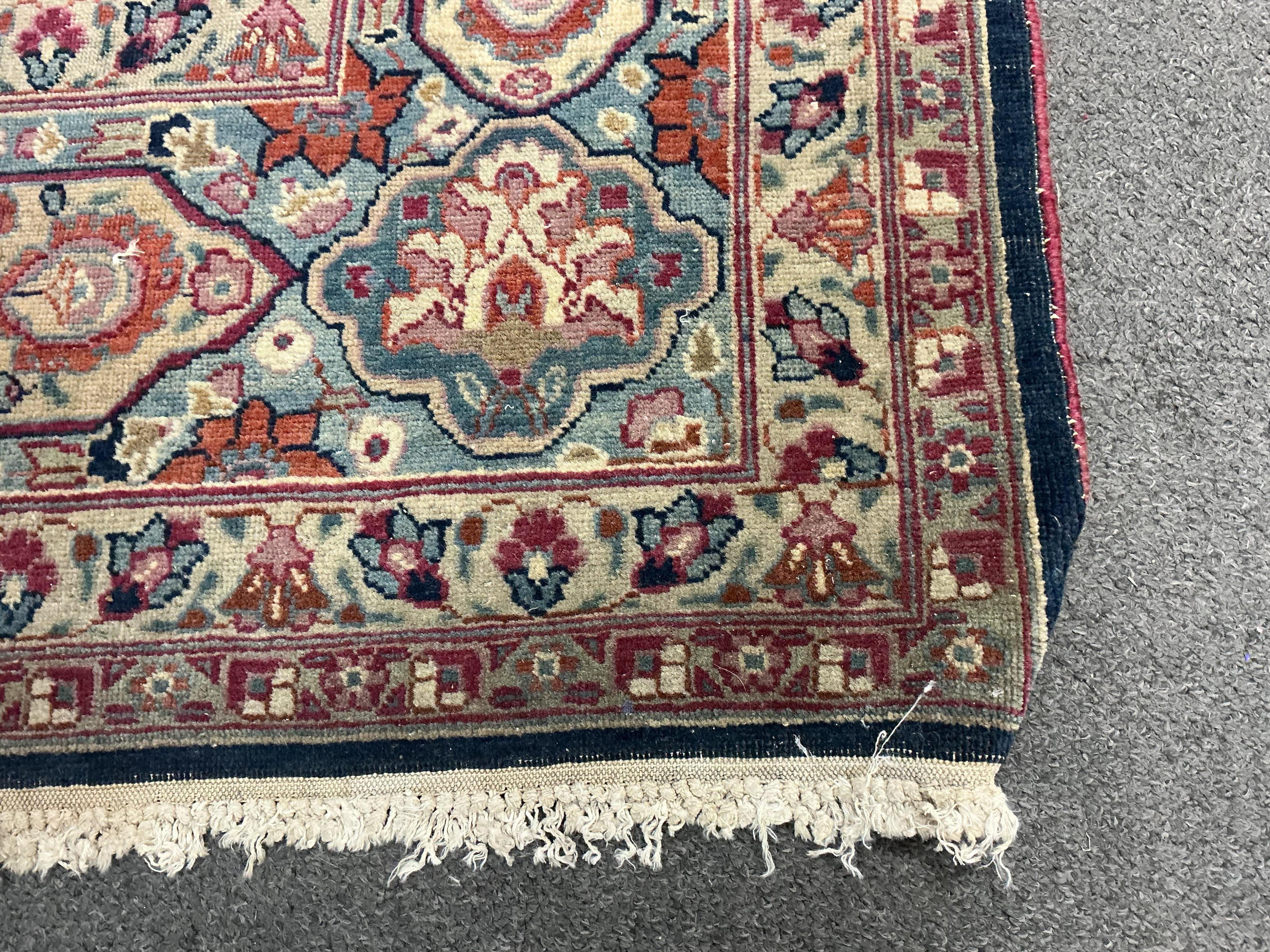 An early 20th century Kashan blue ground carpet, 315 x 206cm